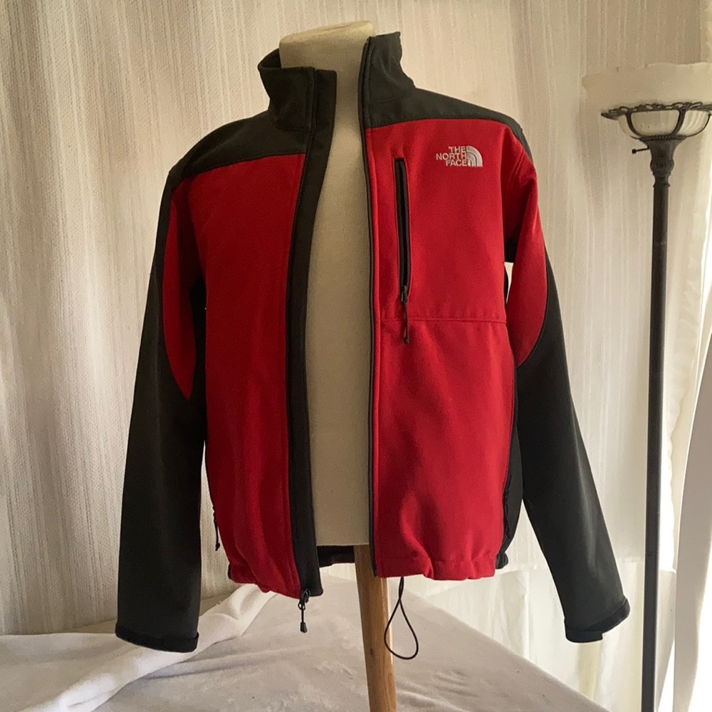 Red and Gray North Face windbreaker. Men’s size:L